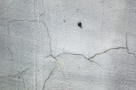 cracked and aged gray wall background with good texture
