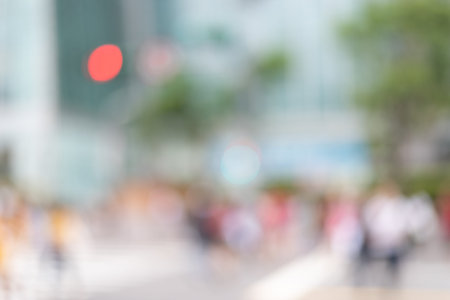 blurred city scenery with people walking at the street