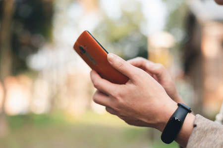 woman using smartphone, concept of social media and technology in the outdoorの写真素材