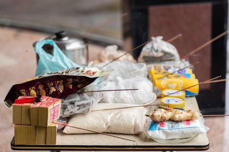 Nantou, Taiwan - August 15th, 2019: Taiwanese people put pork, drink and snacks on a table for the...