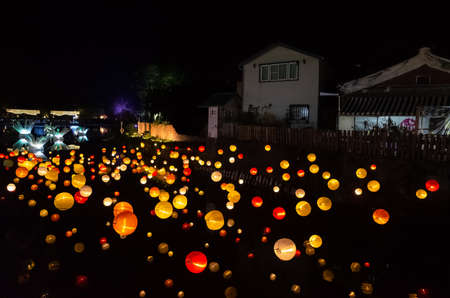 Tainan City, Taiwan - Feb 3rd, 2020: Yuejin Lantern Festival, lanterns decoration hanging over the river at night during the Chinese New Year with crowd at Yanshui, Tainan, Taiwanのeditorial素材