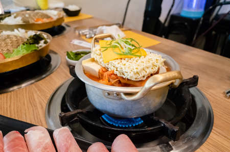 Korean food of army stew or army base stew (Budae Jjigae) in the restaurantの写真素材
