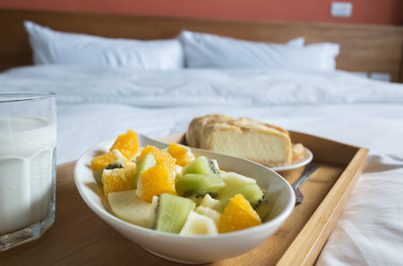 breakfast with milk, fruit and cake at morning