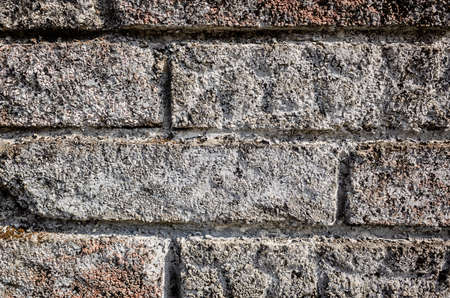 gray brick wall with rough texture backgroundの写真素材