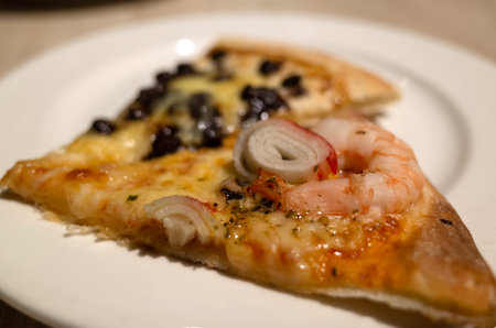 eat small piece of pizza at a restaurant