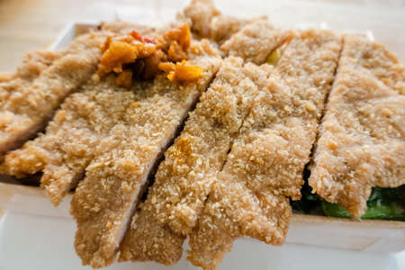 fried pork chop lunch box on the table in a Chinese restaurantの写真素材
