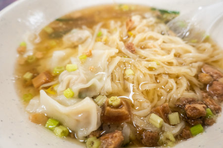 Taiwanese famous wonton noodles in a bowl at a restaurant
