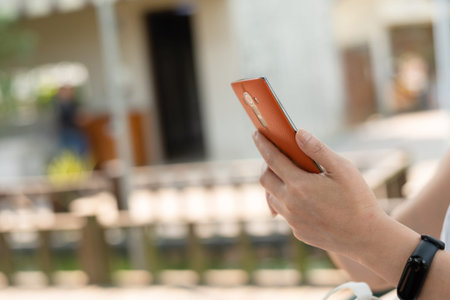 woman using smartphone, concept of social media and technology in the outdoorの写真素材