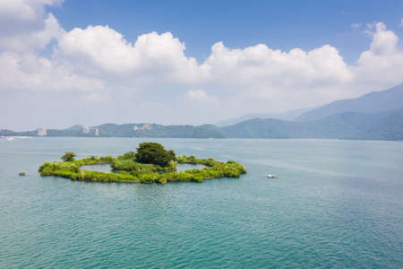 aerial view of a small island named "Lalu" at famous Sun Moon Lake landscape in Nantou, Taiwanの写真素材