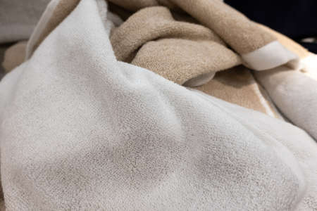 mass cloth and towels background in a marketplaceの写真素材