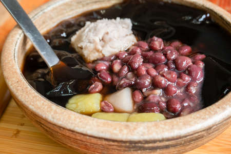 ice cream of mesona black herbal tea with adzuki beans, taro balls and yam paste in Taiwanの写真素材