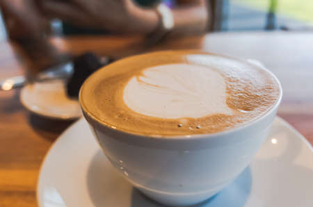 mocha coffee with latte art on a table in the coffee shopの写真素材