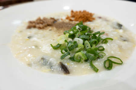 famous Taiwanese snacks, congee with pork and century eggs, closeup imageの写真素材