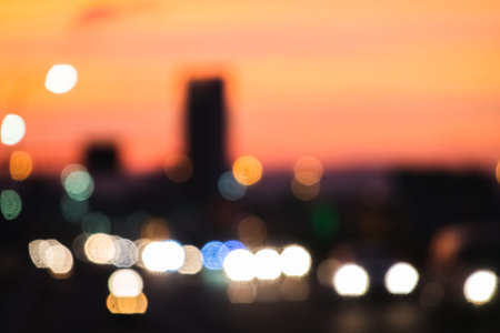 urban scenery with cars lights at bridge and building illuminated in the night, shallow depth of focusの写真素材