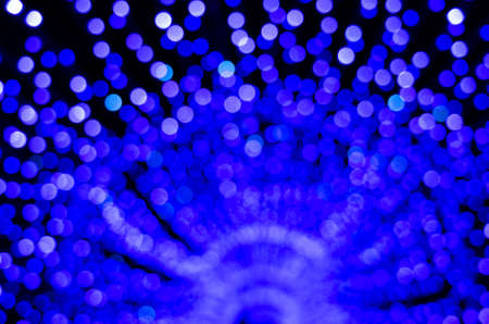 illuminated bokeh background with copy space in the nightの写真素材