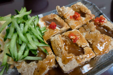 stinky tofu, famous Taiwanese snack in a storeの写真素材