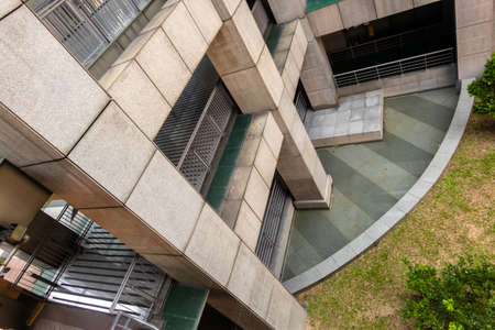 modern garden with pond and skyscrapers in the cityの写真素材