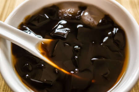 traditional Taiwanese snacks of mesona black herbal tea in a bowlの写真素材