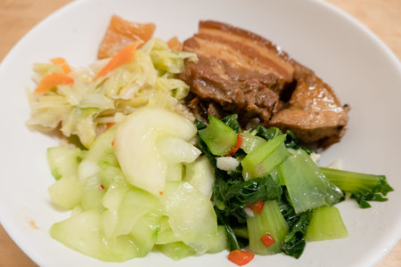 soy-stewed pork with vegetables and rice in a bowl at Taiwan