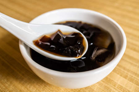 traditional Taiwanese snacks of mesona black herbal tea in a bowlの写真素材