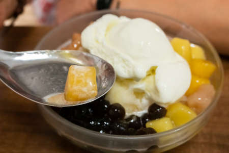eating shaved ice with colorful dessert, famous Taiwan snacksの写真素材