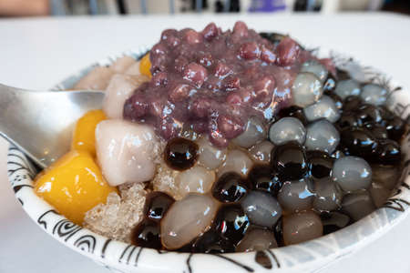 eating shaved ice with colorful dessert, famous Taiwan snacksの写真素材
