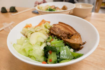 soy-stewed pork with vegetables and rice in a bowl at Taiwanの写真素材