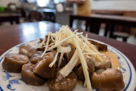 taiwanese special snack of sticky rice sausage on a plateの写真素材