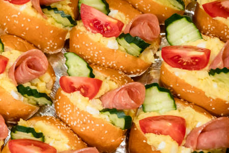 sandwiches with pork and bread on the deskの写真素材
