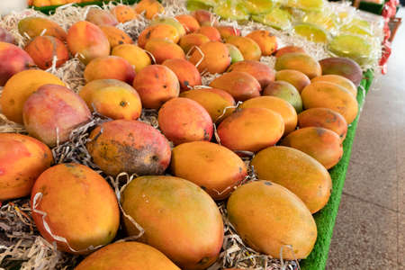stacks of mango at the traditional marketplace in Taiwanの写真素材