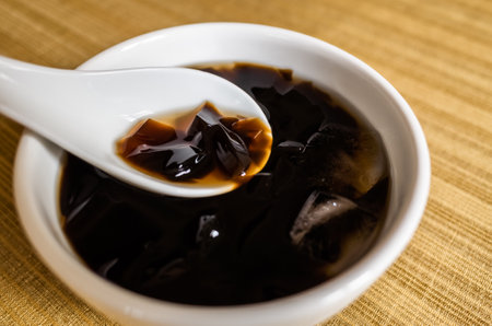 traditional Taiwanese snacks of mesona black herbal tea in a bowlの写真素材