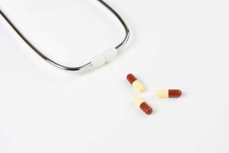 Composition of pills with stethoscope の写真素材
