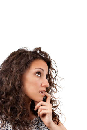 Beautiful lady thinking and looking up on a white backgroundの写真素材