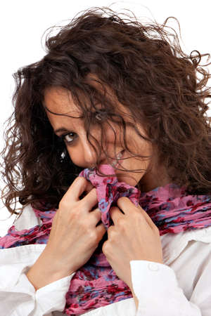 Attractive young woman smiling shyly on white background.の写真素材