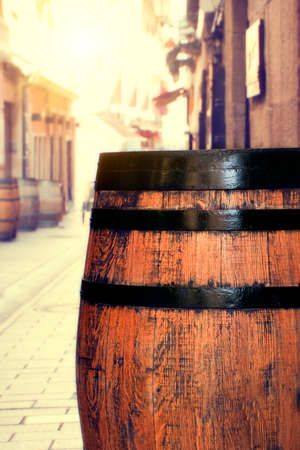 Wooden barrel on a street in Logroño. More barrels in the background.の写真素材