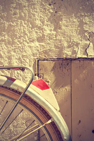 Detail of retro bicycle wheel. It looks part of the rear fender and the brake. Vintage style. Vertical image.の写真素材