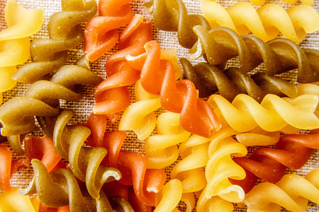 Italian uncooked Fusilli raw pasta. Horizontal image.