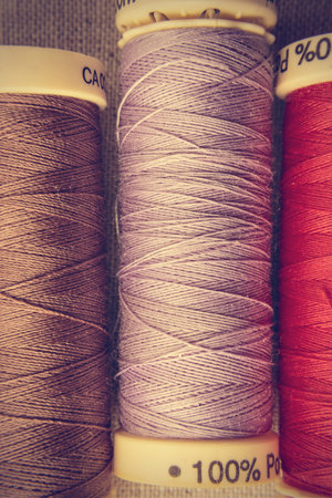 Spools of thread in a retro vintage style. Vertical image.