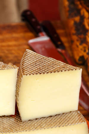 Wedge of Manchego cheese on a traditional market.Vertical image.の写真素材