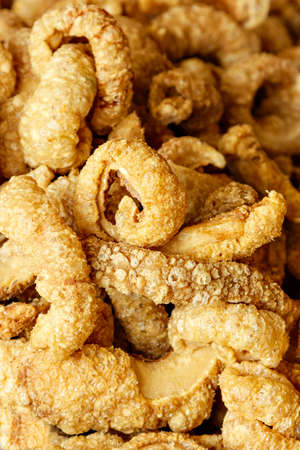 Pork rinds on a traditional craftsman market.Vertical image.の写真素材