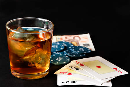 Poker of aces with poker chips and whiskey. Horizontal image.の写真素材