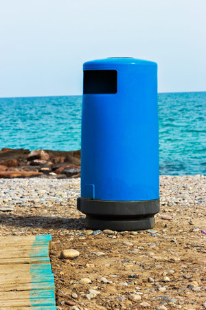 Blue beach trash with walkway. Vertical image.の写真素材