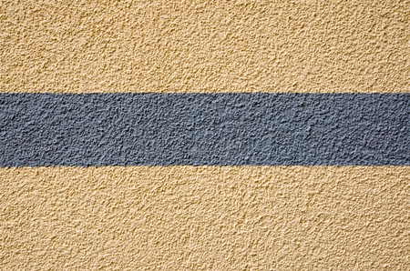 Yellow plaster with a grey stripeの写真素材