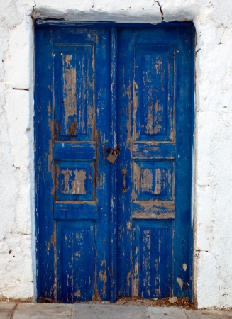 A blue door seen on a Cyclade islandの写真素材