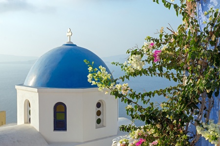 Church with flowers in Oia の写真素材