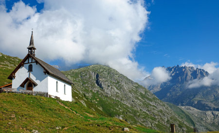 Landscape with church in the alpsの写真素材
