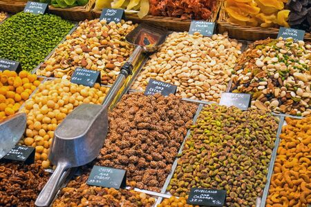 A selection of nuts at the famous La Boqueria market in Barcelonaの写真素材