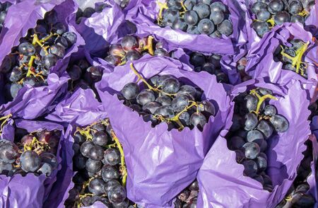 Red grapes for sale at a marketの写真素材