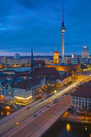 Berlin Alexanderplatz with the famous television tower at nightの写真素材