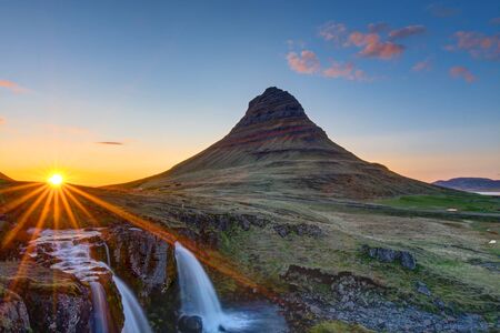 Mount Kirkjufell and the Kirkjufellsfoss in Iceland before sunsetの写真素材